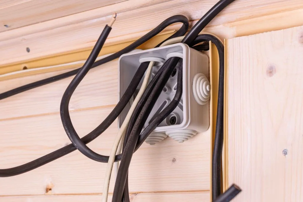 House wiring upgrades feature tightly bundled wires around a plastic electrical junction box